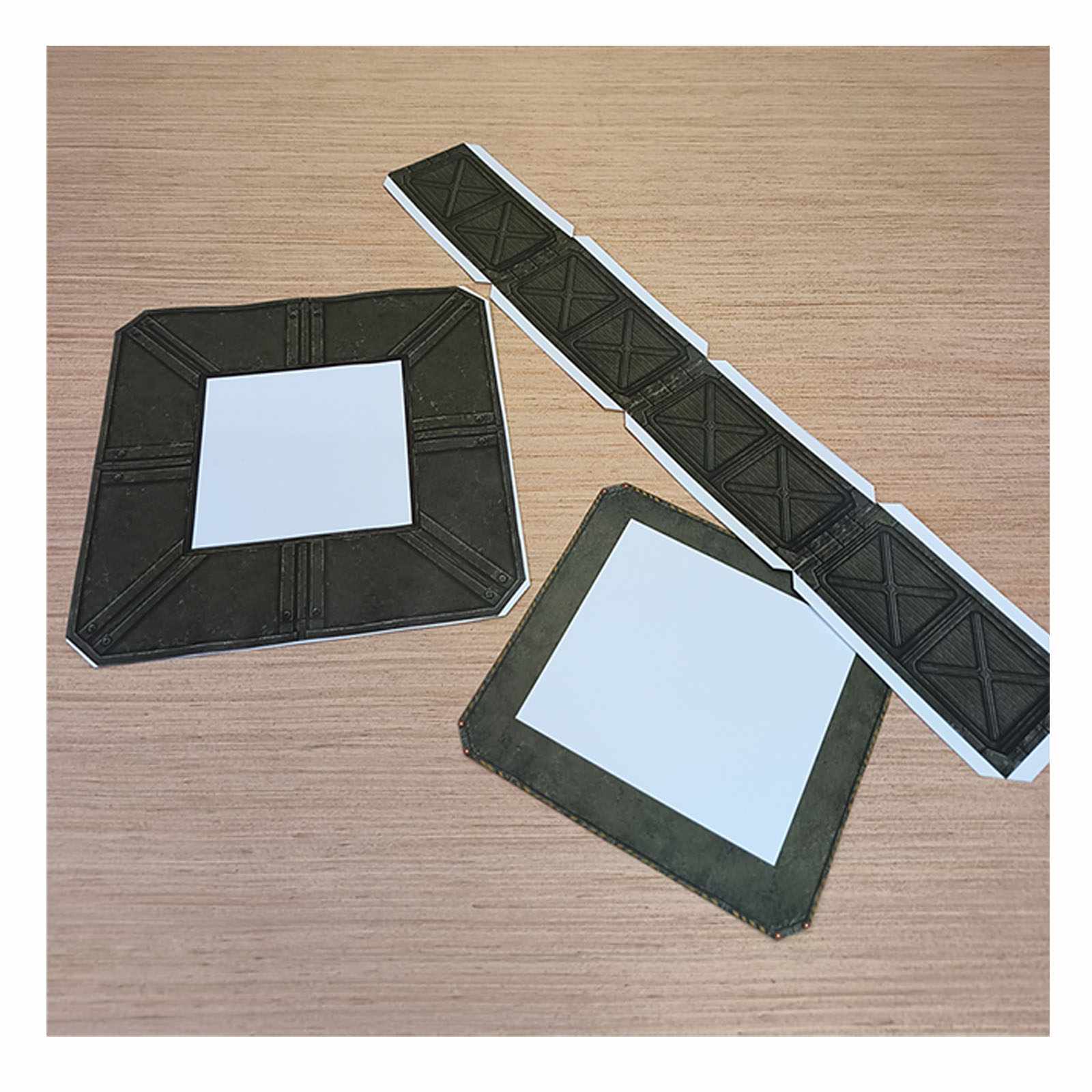 Partially assembled Army Green papercraft helipad without the detachable access ramp