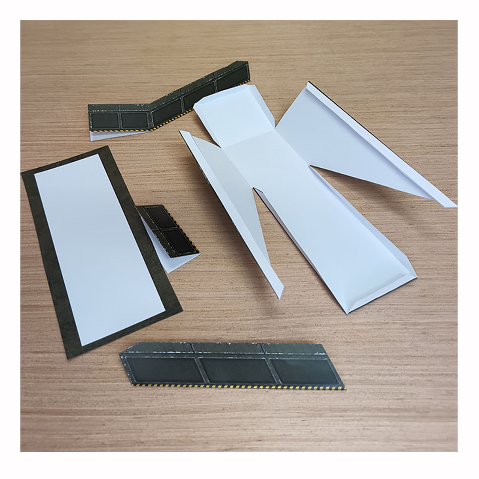 Army Green helipad access ramp partially folded and glued during the papercraft build