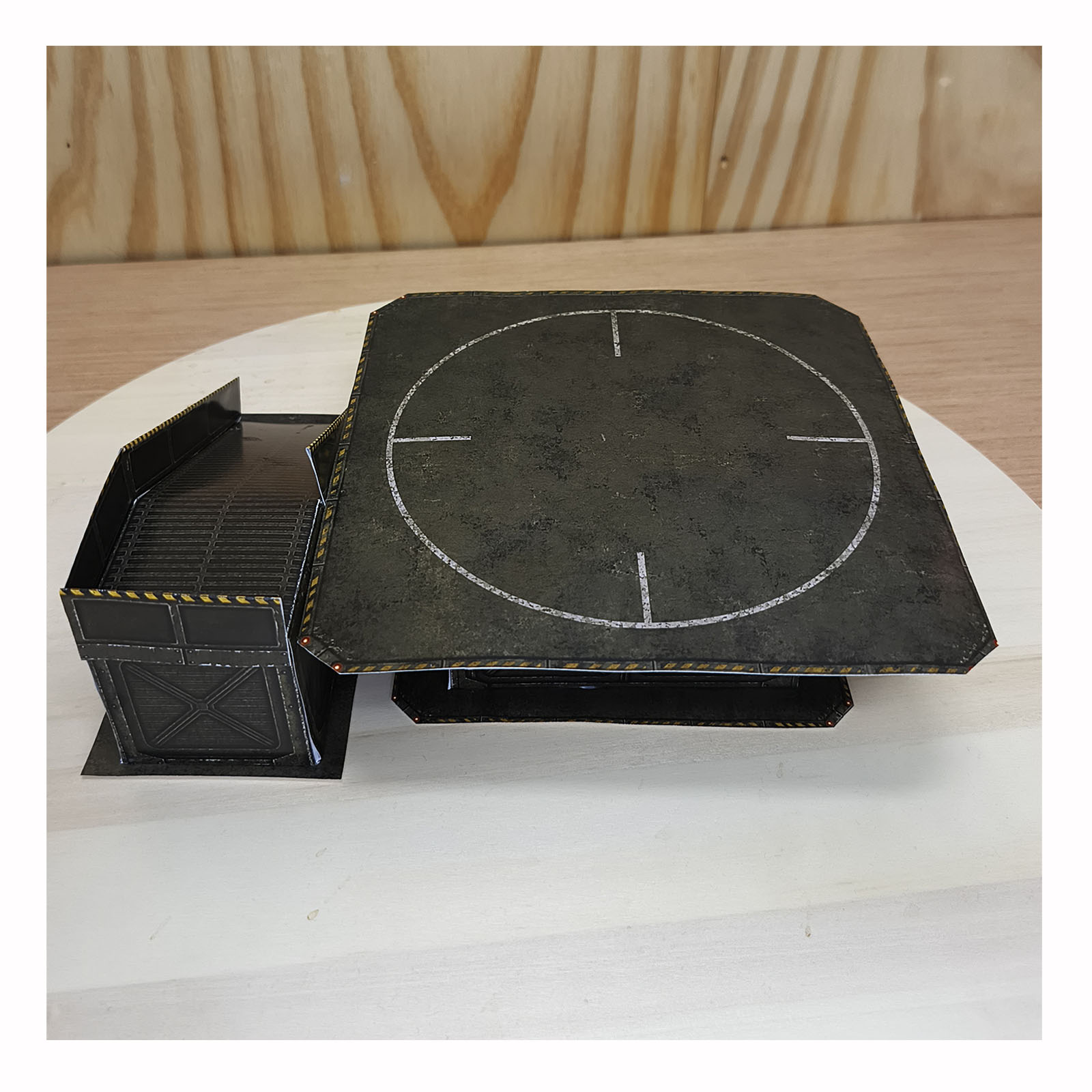Top view of the completed Army Green military-style papercraft helipad and access ramp
