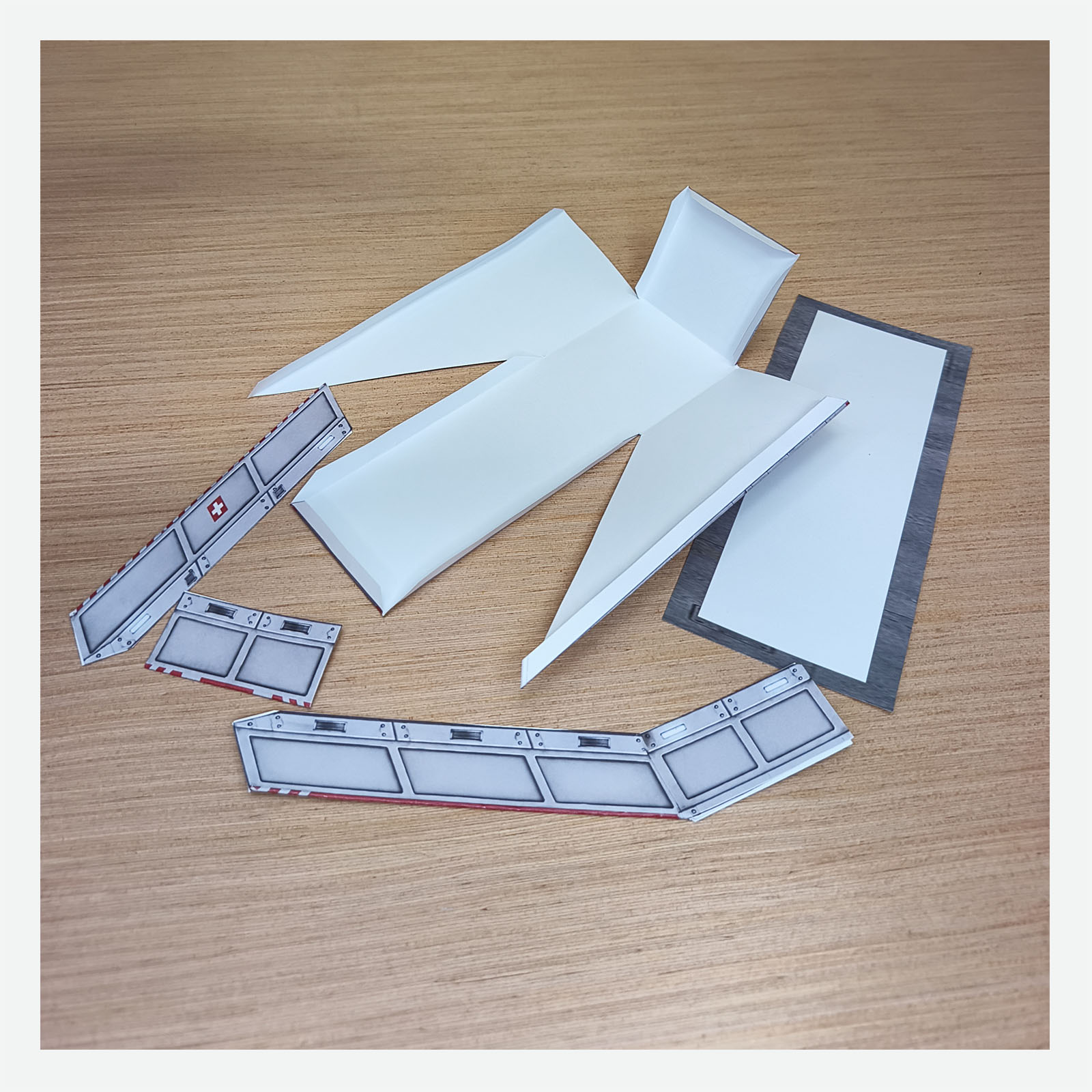 Hospital helipad access ramp partially folded and glued during the papercraft assembly process
